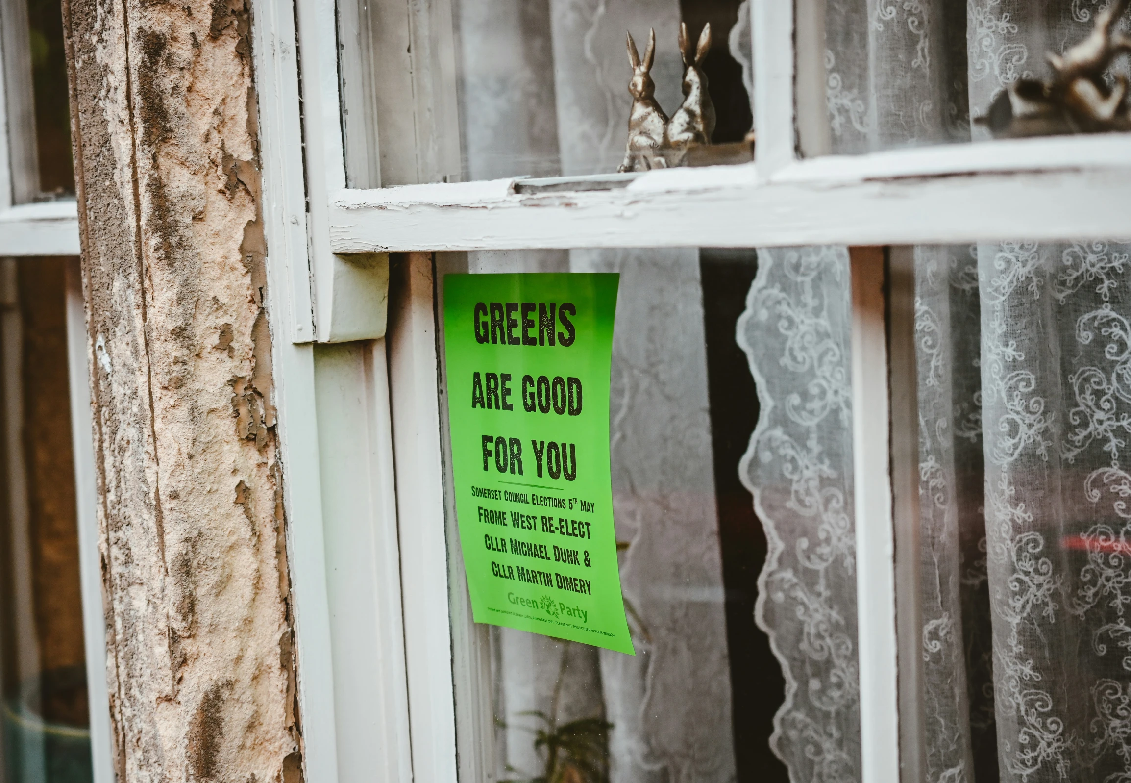 an advertit for breaded bread placed on the outside of a window