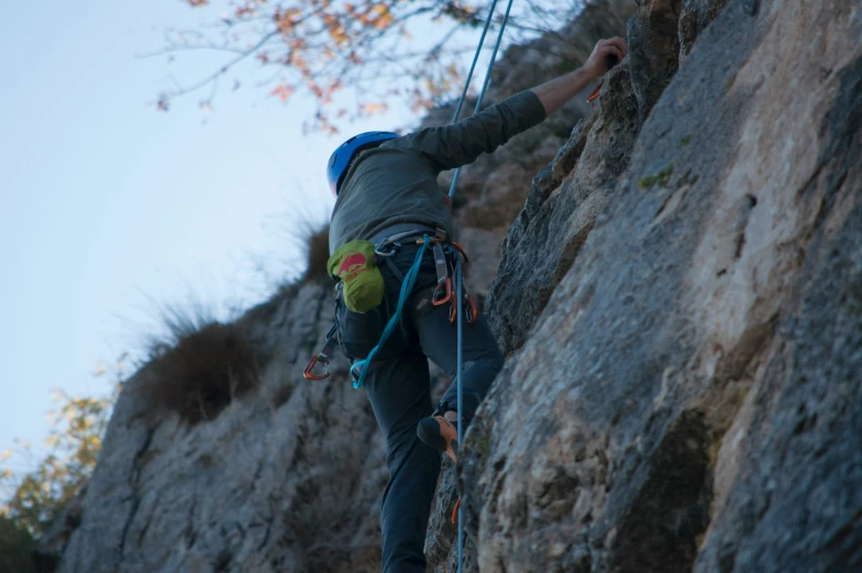 someone climbing up and down a steep cliff