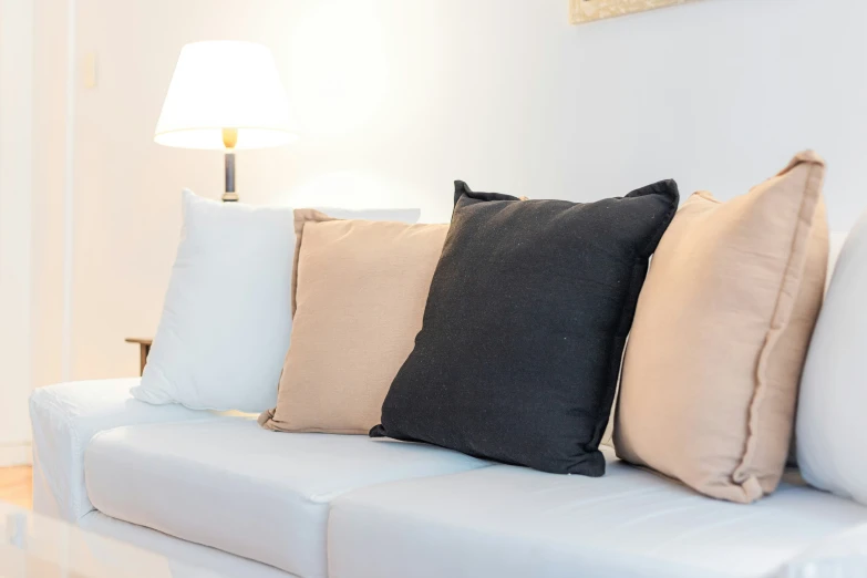 some pillows that are sitting on a couch