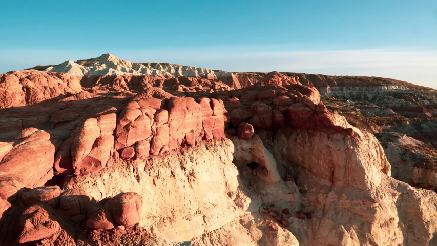 the rocky landscape has many red, white and brown rocks