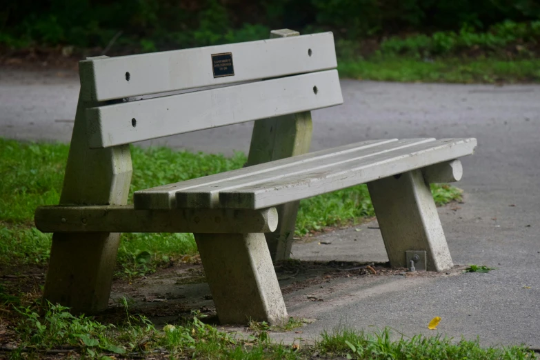 a park bench on the side of a street