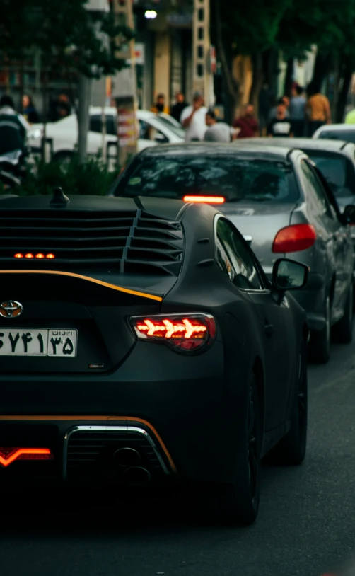 the rear of an automobile passing through traffic on a street