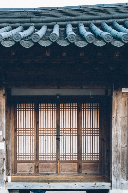 a wooden building with open wooden doors