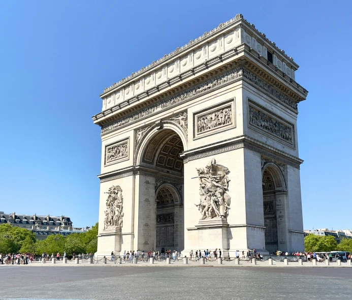 a large arch with people standing on the sides