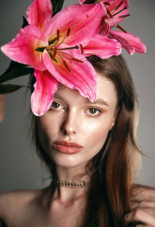 a woman with pink flowers in her hair