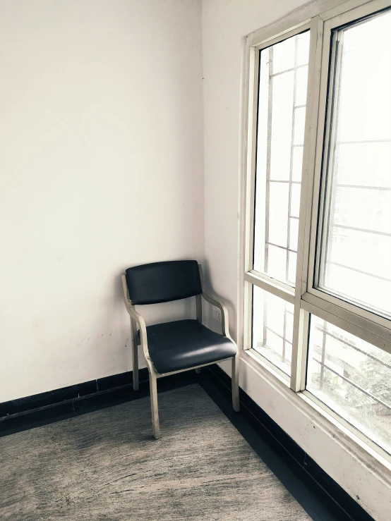 a white chair sitting on top of a carpeted floor