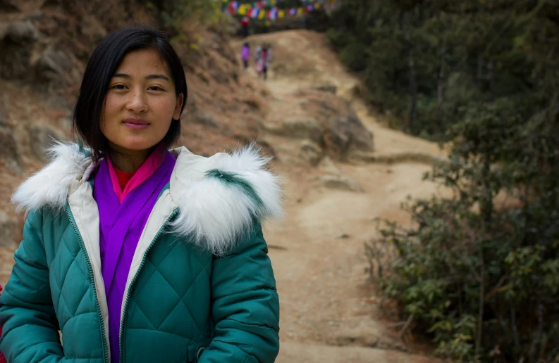 an image of a woman that is standing up on the trail