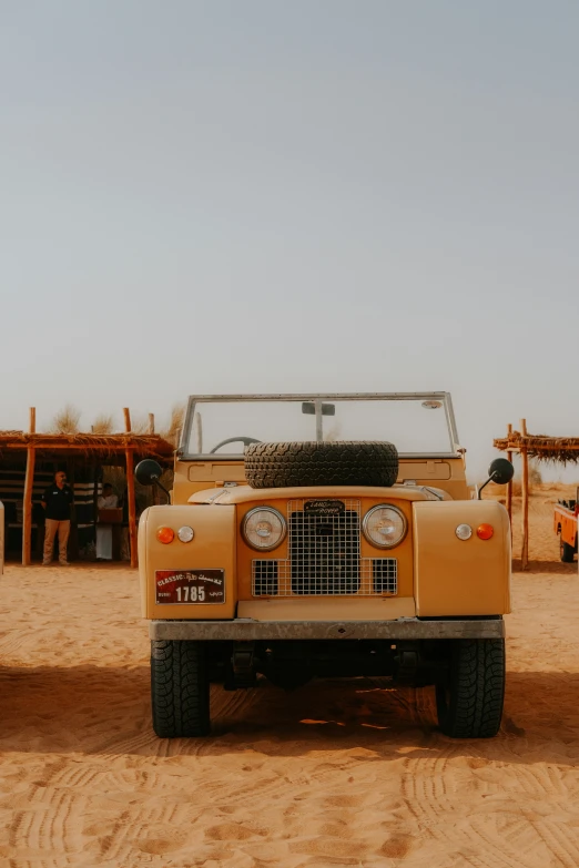 the yellow suv has a safari hood on it