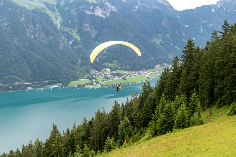 the paraglider is descending to the high altitude