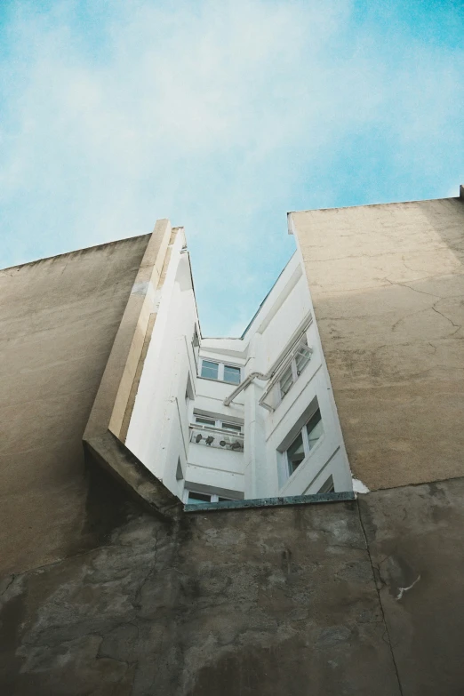 a building with several stories at the bottom is upside down