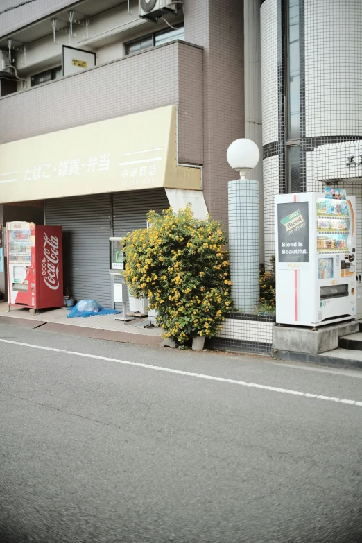 the front of a bank with a yellow sign next to it