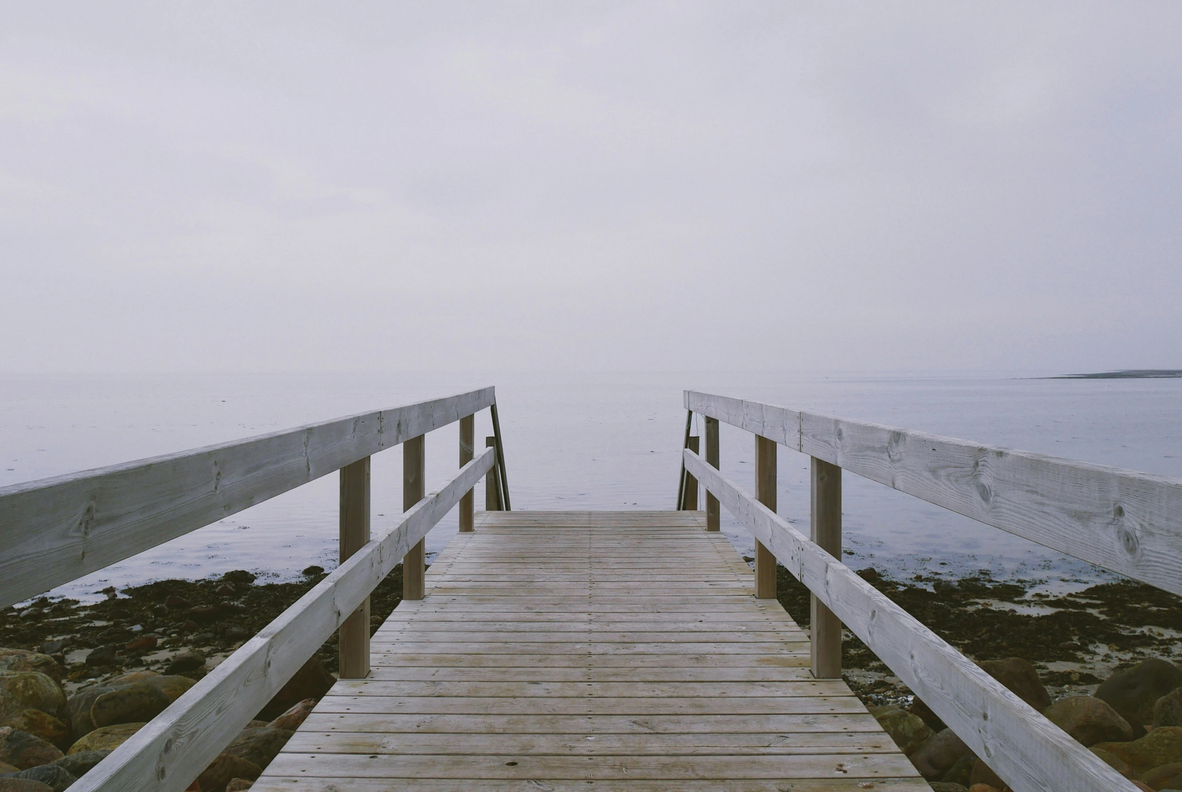 a wooden bridge with some stairs in front of it