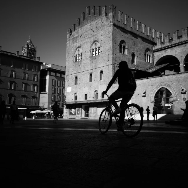 the person is riding a bicycle down the street