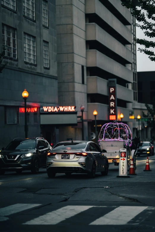 traffic waits at a red light at night in a city