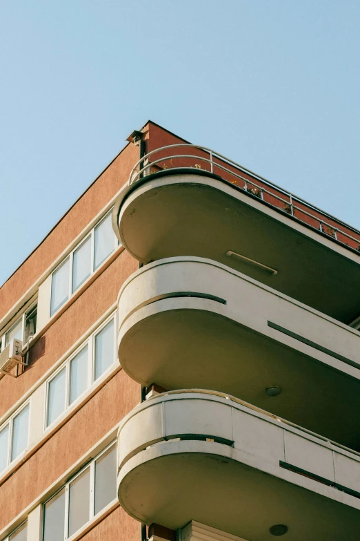 a street sign hanging from the side of a building