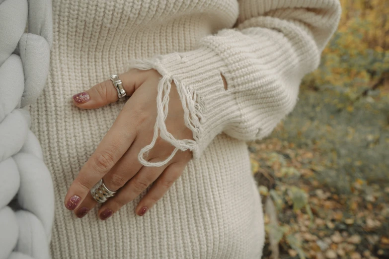 a close up of a person wearing rings