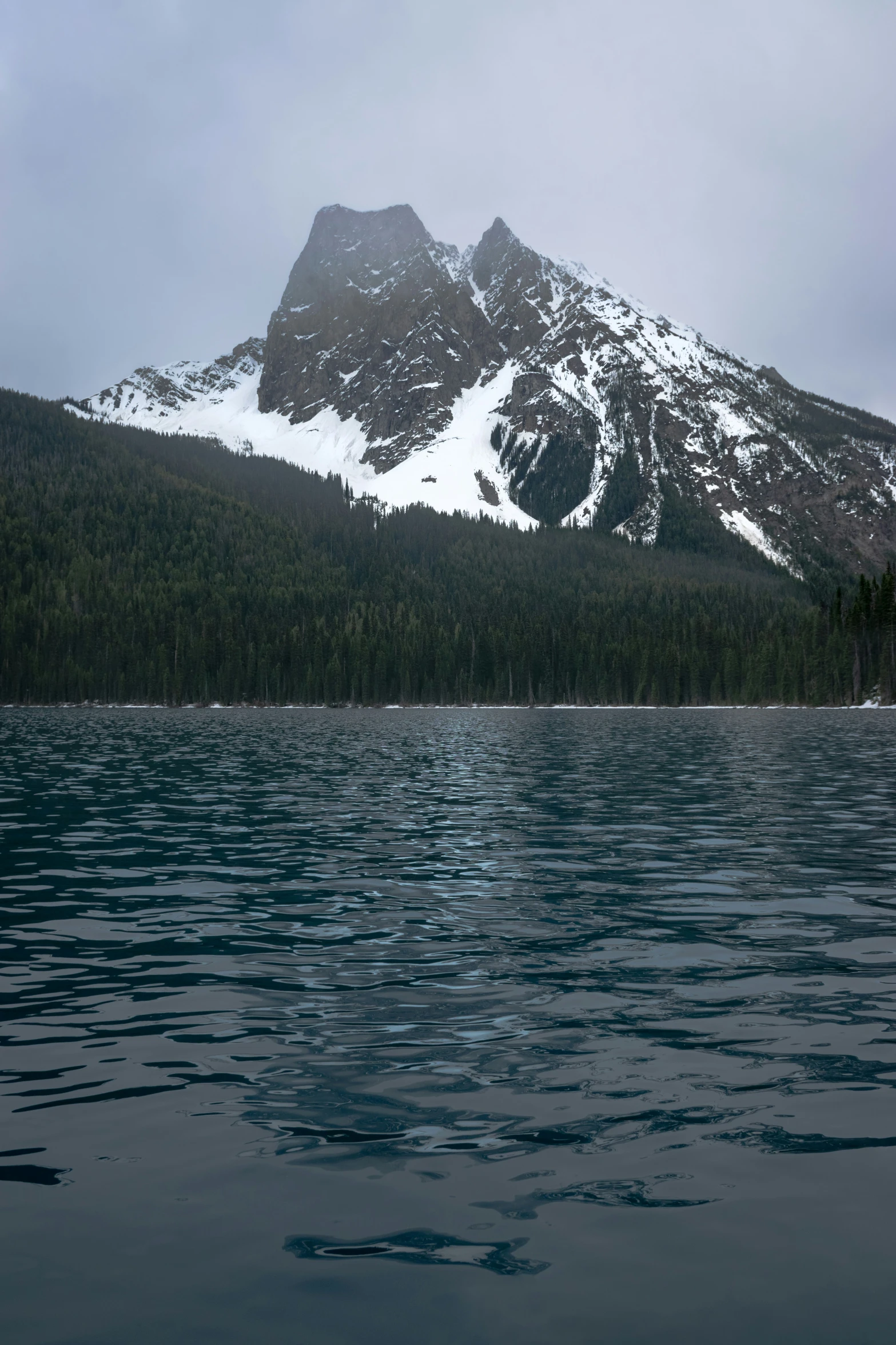 mountains and a lake covered in snow