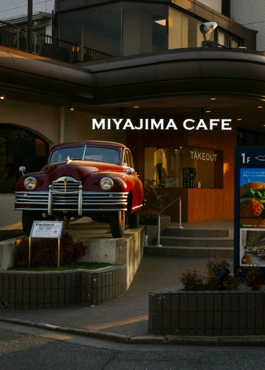 a restaurant with a sign that reads miami cafe