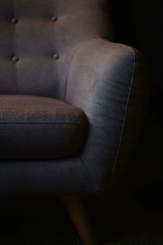 a chair is seen in this dark room