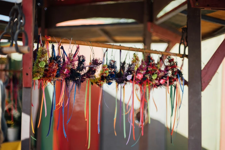 a group of ribbons are hanging on the side of a building