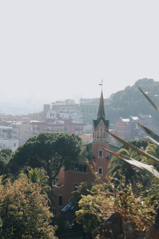 view from above of a cathedral and a village on a hill