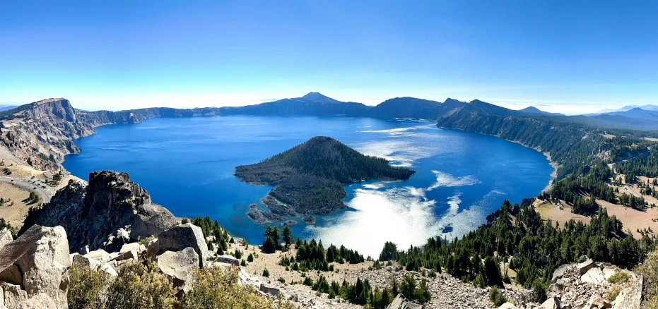 a lake sitting in the middle of a forest