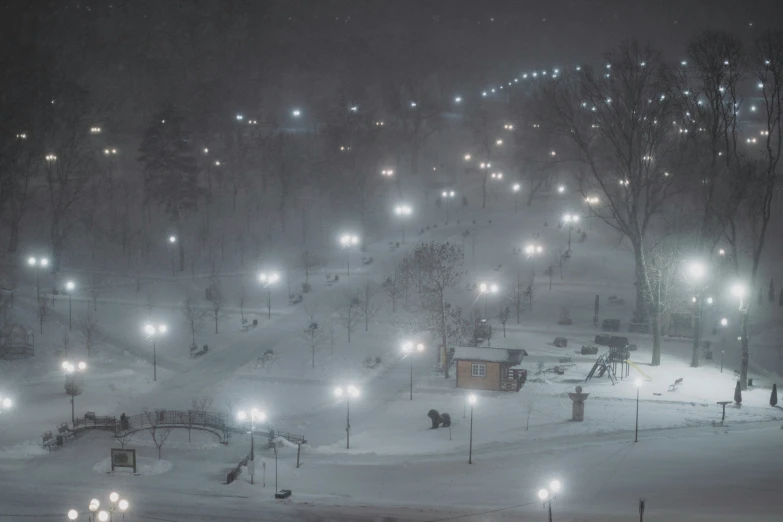 a ski slope at night with street lights on