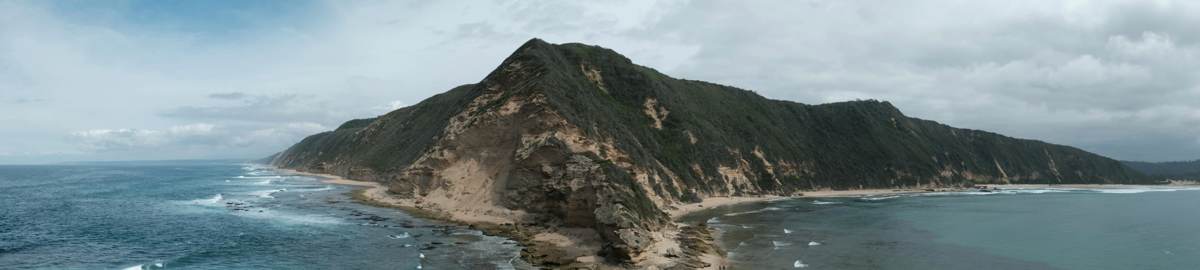 a mountain that is next to the water