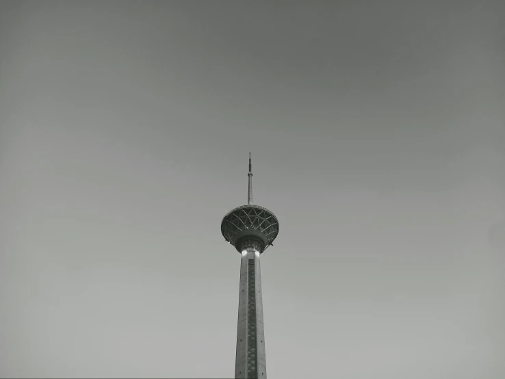 a large tower has lights on top of it