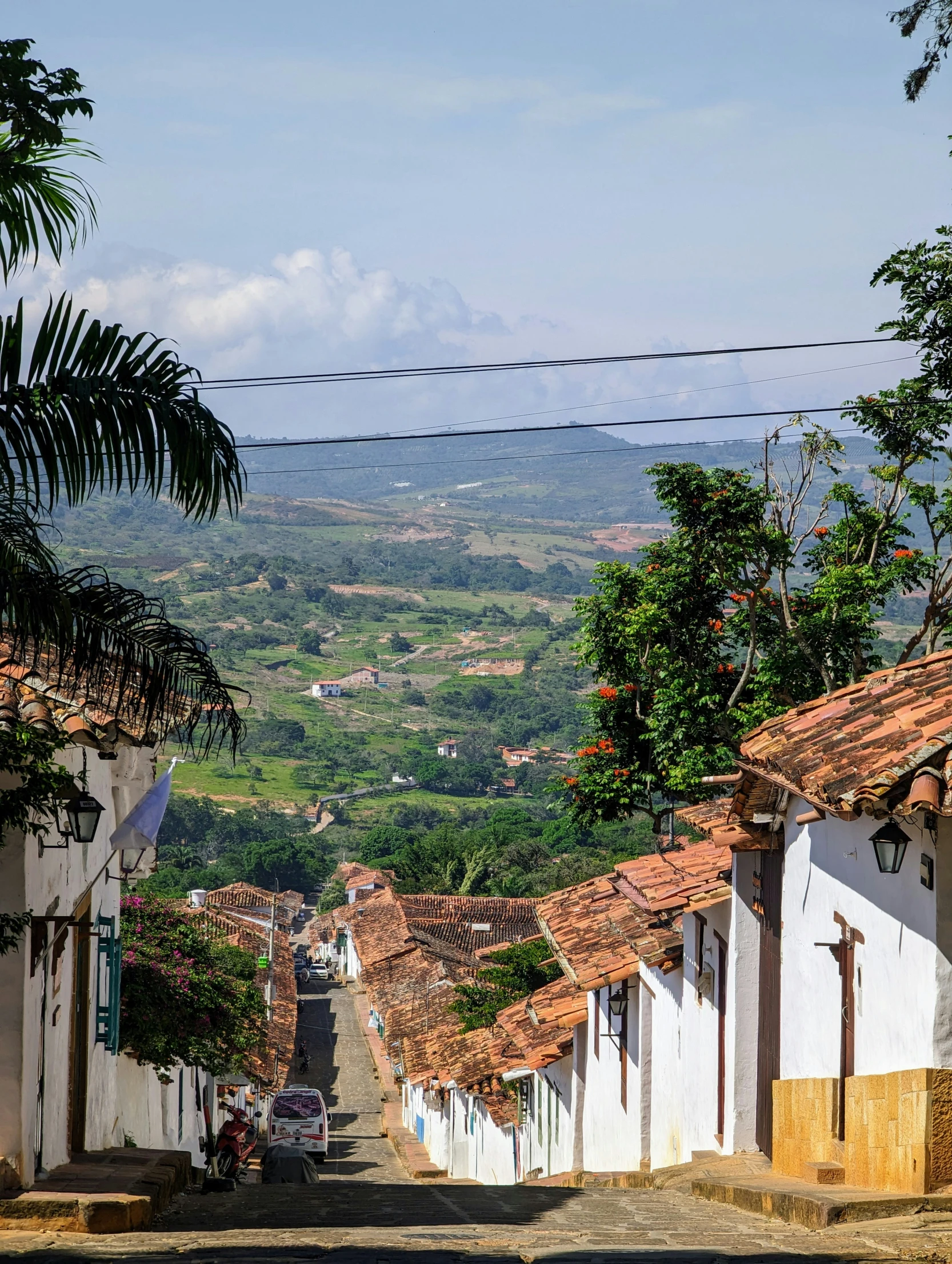 an old village in the distance on a mountain