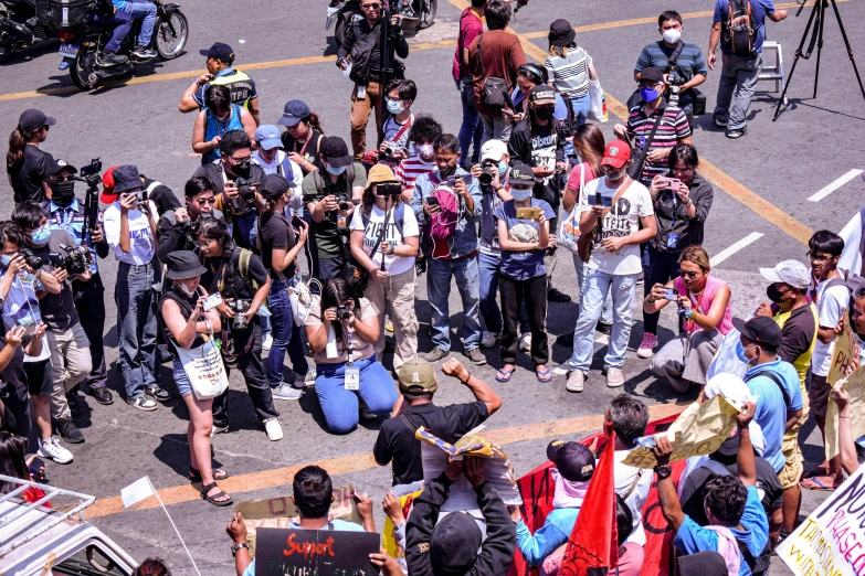 several protesters gather around one another to demonstrate climate change