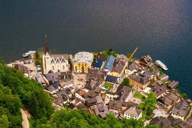 aerial view of houses and church in picturesque area of city