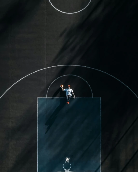 an overhead view of a basketball court with a player about to dunk