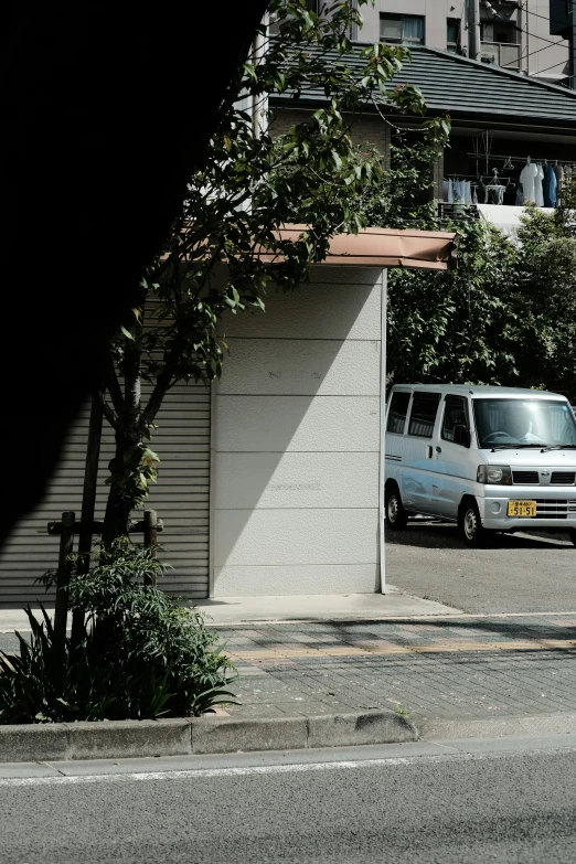 a van is parked in a parking space in front of a garage door