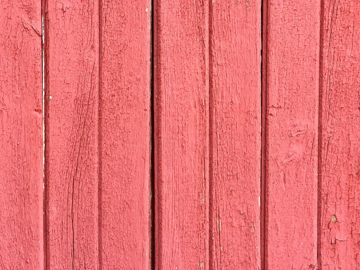 an old red wooden wall with little ridges