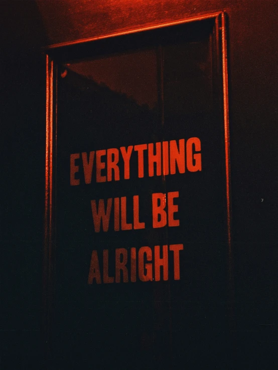 a red sign is written in front of a doorway