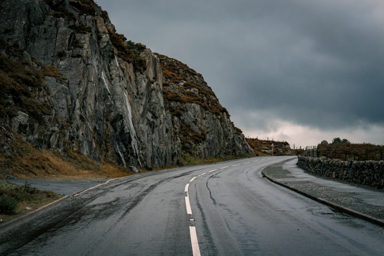 two road ends in front of some rocks