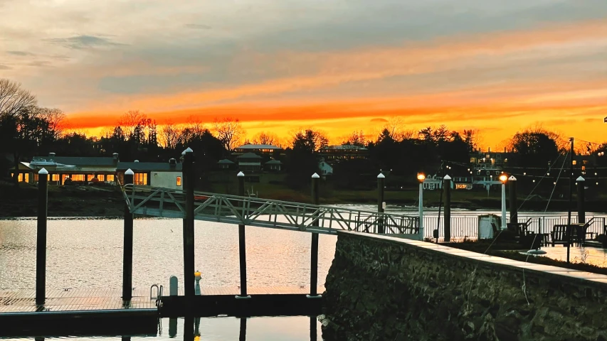 a sunset view over a river and city