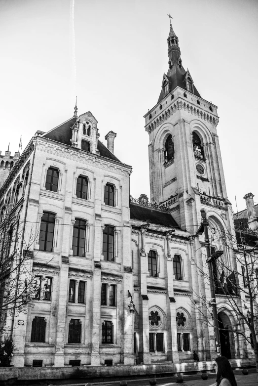 the old building has two towers, with clocks on them