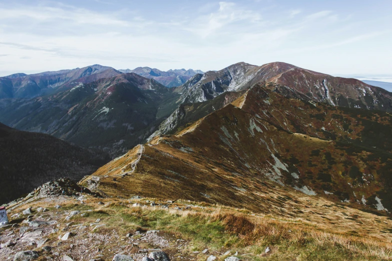 a group of mountain climbers walking up a steep hill