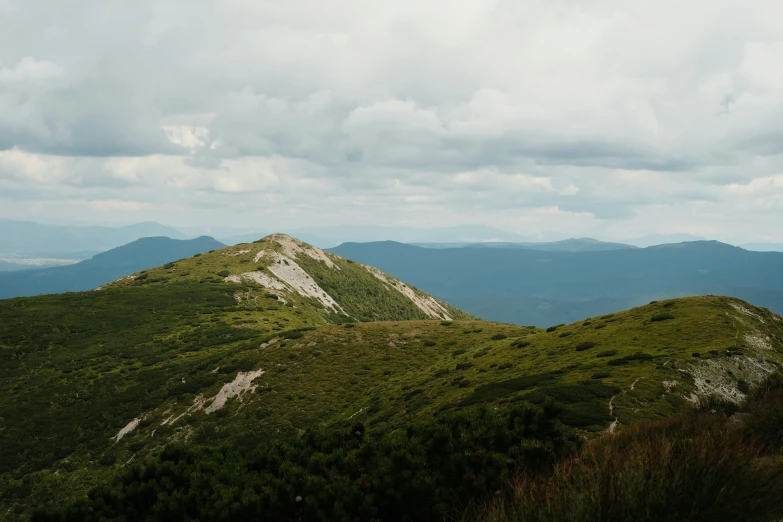 a scenic view of mountains with a sky background