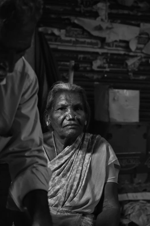 a woman in white standing in front of a man