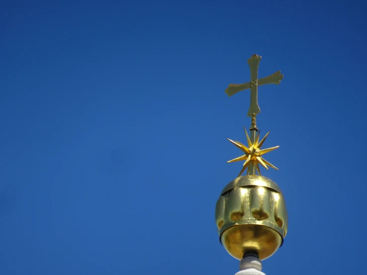 a cross on top of a church's spire