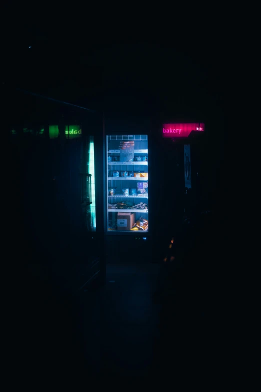 the refrigerators in the dark are glowing brightly