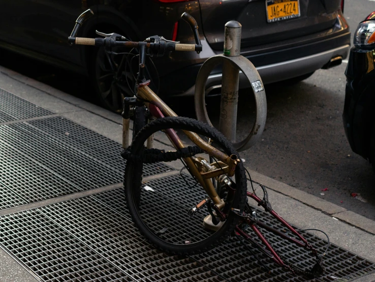 a close up of a bike that has fallen into the ground