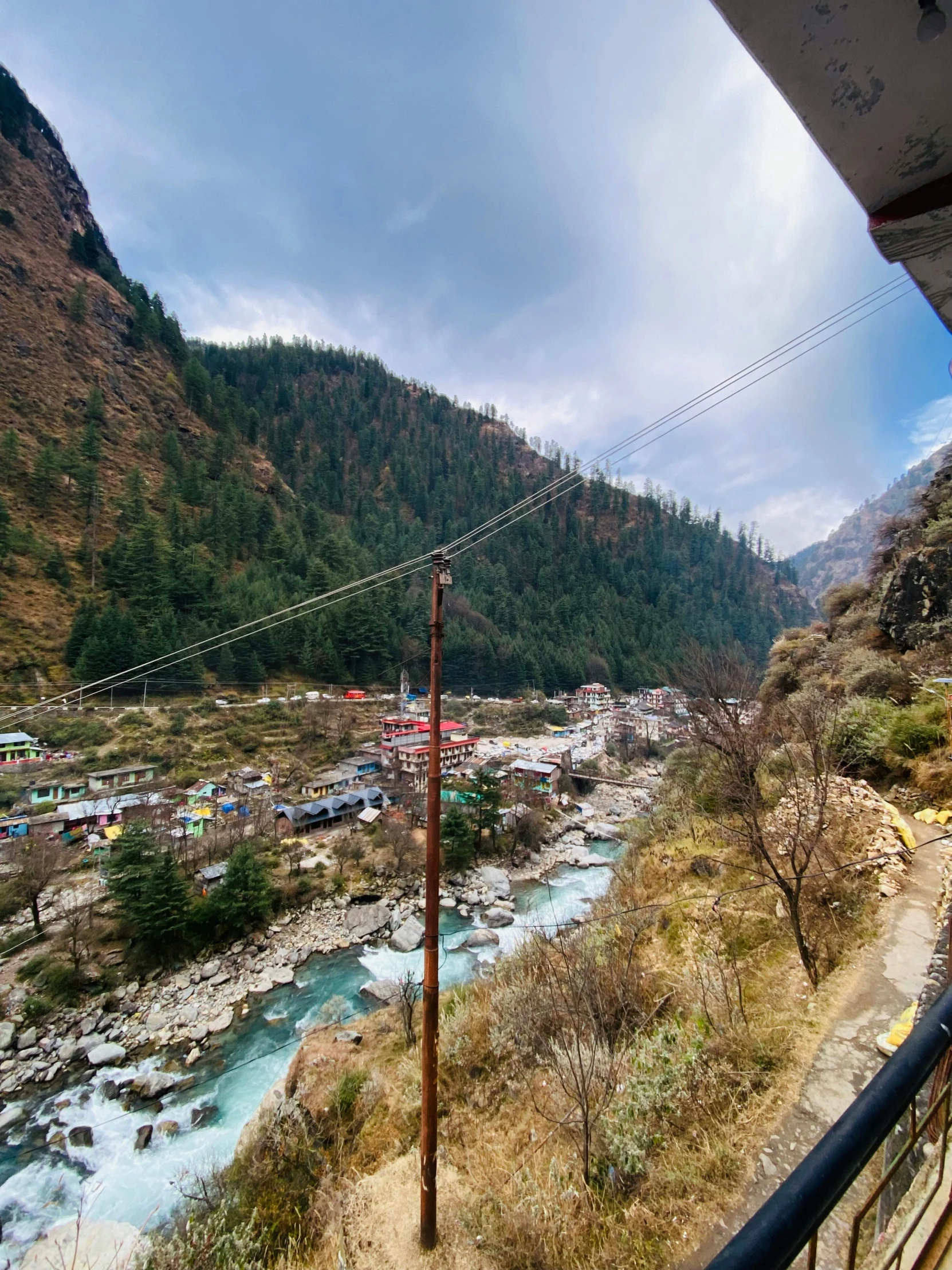 the view from inside a truck of the river and mountains