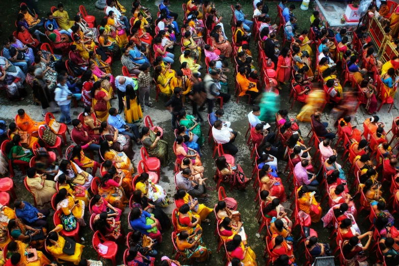 a large crowd of people is standing in a group