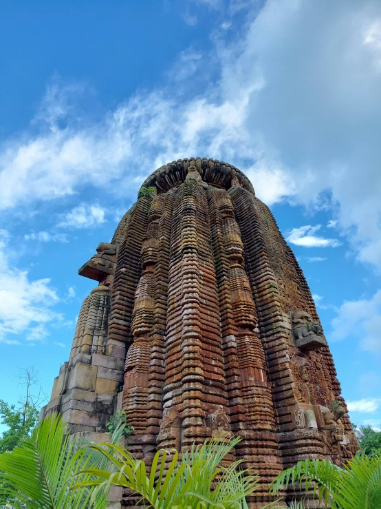 this building has an intricate carved face and long bell