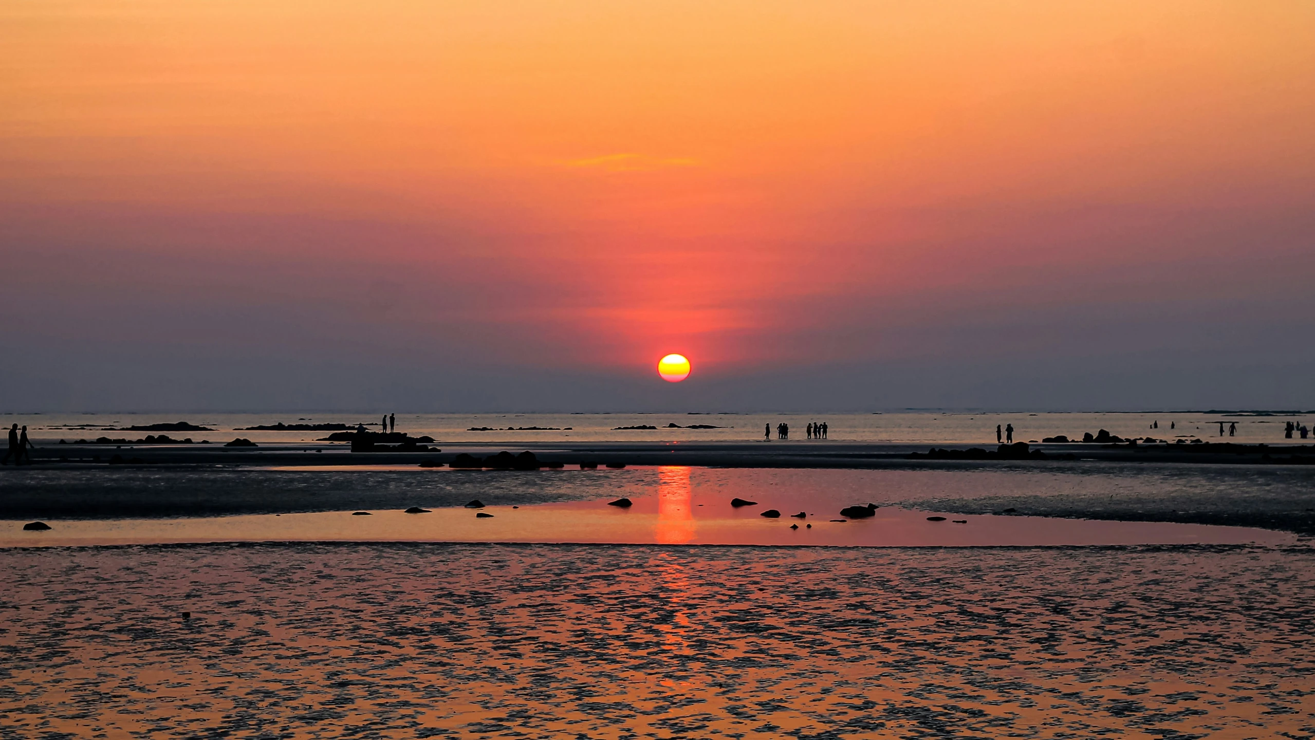 a sunrise reflecting the sun in the water