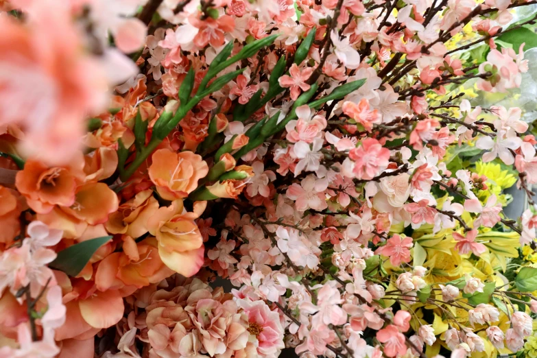 the colorful flowers are hanging on the wall